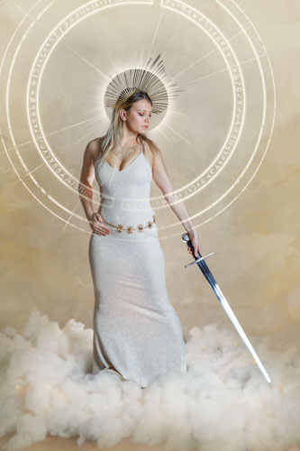 Woman in a fantasy style dress holding a sword, wearing a golden headdress and halos emanating from her head - Kansas City fantasy photography